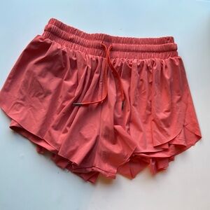 Flowy cute peachy orange shorts.